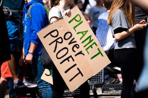 Planet over Profit sign